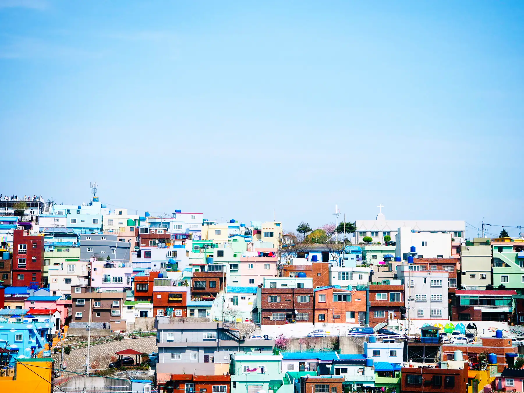 Pastel-coloured houses stacked up a hillside in Busan